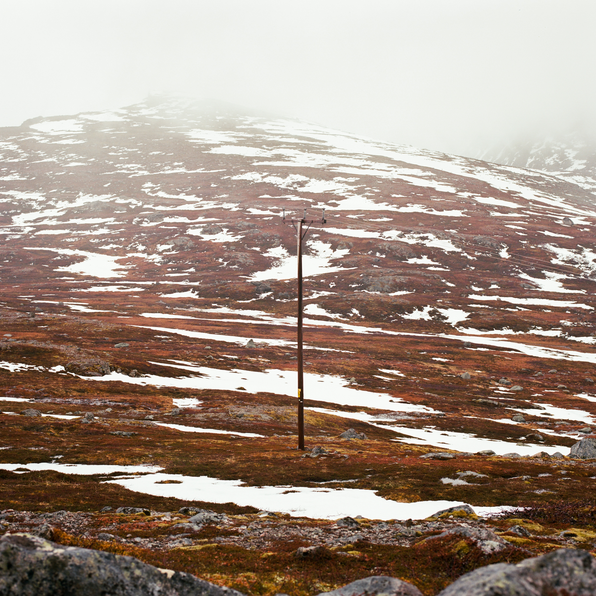Telephone pole on a rocky mountain slope in Norway